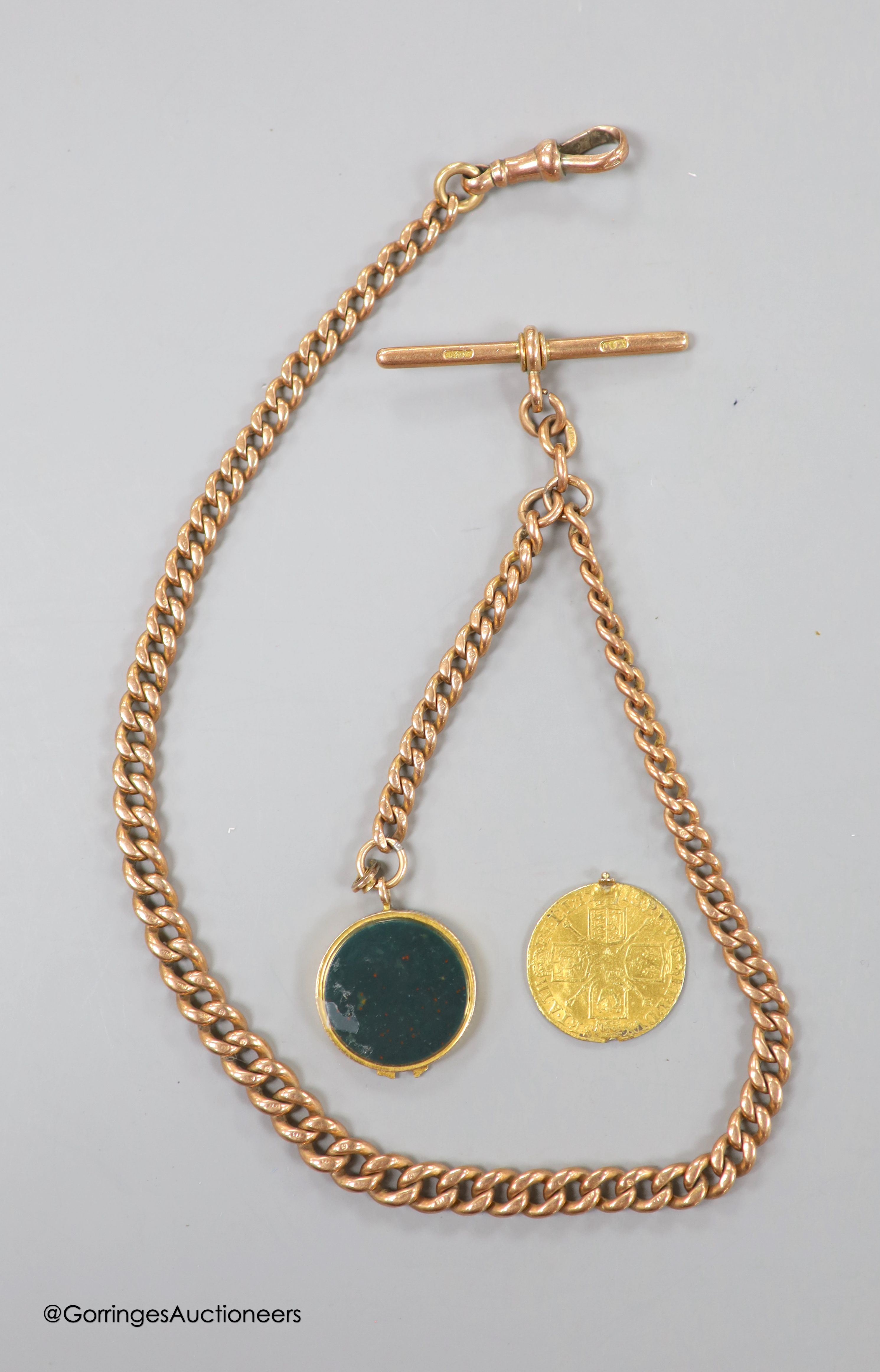 An Edwardian 9ct albert chain, 37.5cm, 33.3 grams. hung with a yellow metal and bloodstone and gold coin set locket charm, gross weight 8 grams.